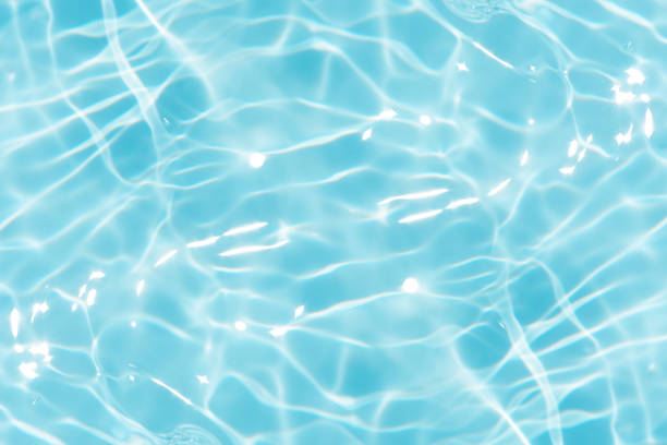 istock Blue water with ripples on the surface. Defocus blurred transparent blue colored clear calm water surface texture with splashes and bubbles. Water waves with shining pattern texture background. 2160360199