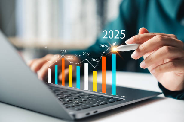 Businesswoman analyze the profitability of companies using digital graphs, positive trends for 2025. A businesswoman analyzes the profitability of operating companies using digital graphs, positive trends for 2025. savings account stock pictures, royalty-free photos & images
