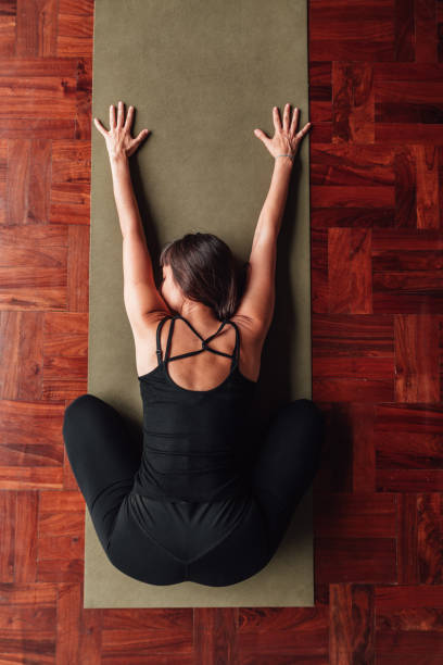 istock Beautiful figure of a woman practicing forward bending. Wellness Concept. 2160369056