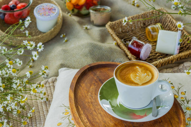 istock Beautiful white boho style decor. Picnic in nature on the grass under the tree 2160369689