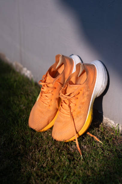 istock Shoes in the grass 2160371122