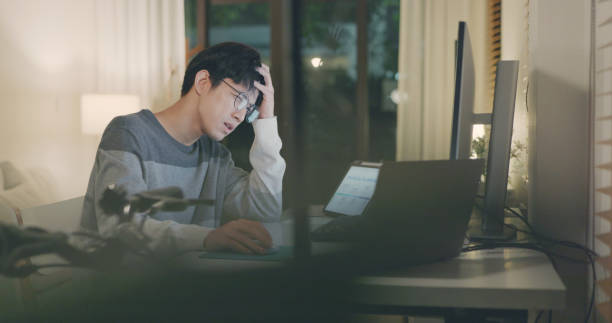 istock Stressed Businessman in Home Office. 2160373436