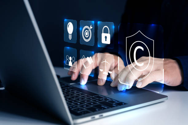 istock Businessman use laptop with virtual copyright symbol for author rights and patented intellectual property. 2160373486