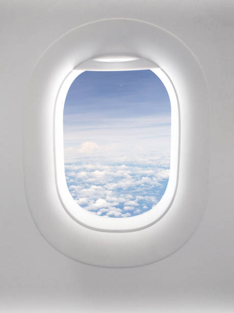 istock View of a clear sky with fluffy clouds in an open airplane cabin. 2160373519