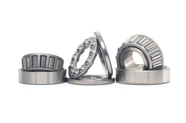 istock Tapered roller and thrust ball bearings isolated on white 2160375187
