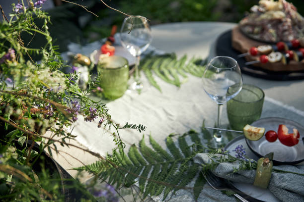 istock Summer festive garden table setting in a forest-inspired green palette 2160381851