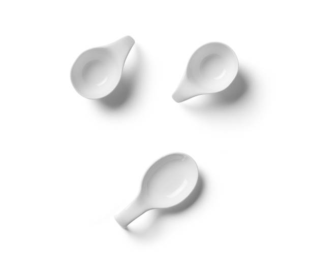 istock Three empty modern oval white porcelain sauce cups, isolated on white 2160386180