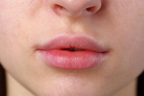 istock Close Up of Womans Lips and Nose 2160386644