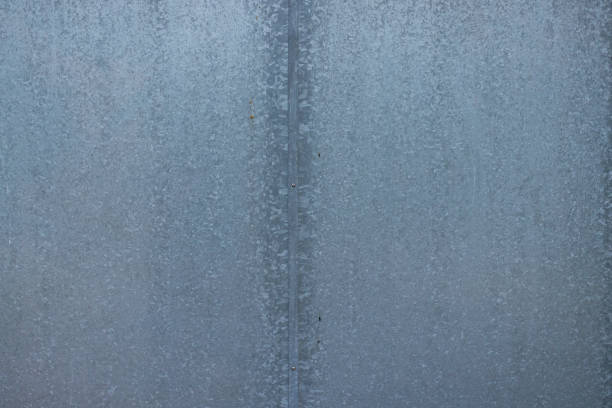 Galvanized zinc plated metal plate viewed from the front. Typical texture of a zinc galvanized metal, used for doors, closures etc.
