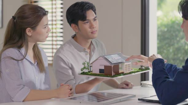 istock Engineer Consultation Over Architectural Model with Solar Energy Design. 2160390882