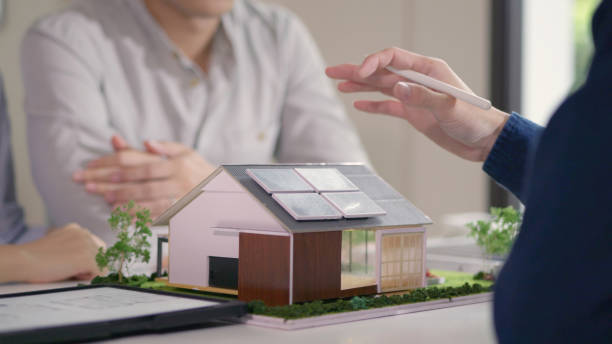 istock Expert Presenting Solar Energy Model to Prospective Homebuyers. 2160390887