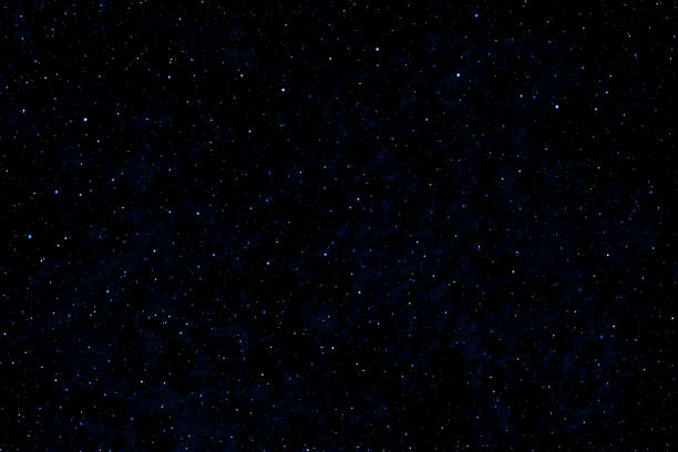 istock Stars in space. Dark blue galaxy space background. Glowing stars in the night. 2160394338