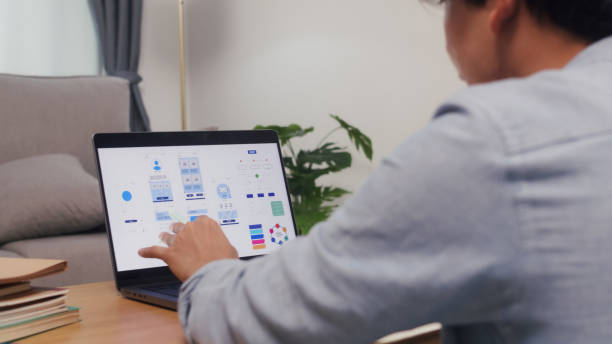 istock Asian Businessman Engaged in Mobile App Development. 2160397926