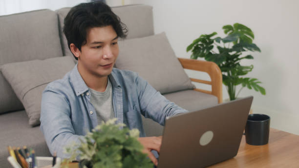 istock Young Asian Man Working on Laptop. 2160397960