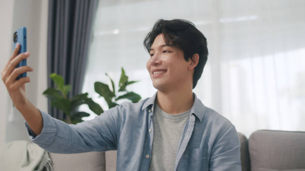 istock Asian Man Captures a Selfie with a Content Smile. 2160397978