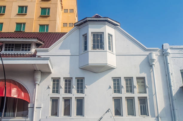 istock Clean white corner bay windows on beach house, contrasting with deep blue sky. Belanda colonialism Building era in Indonesia. 2160398108