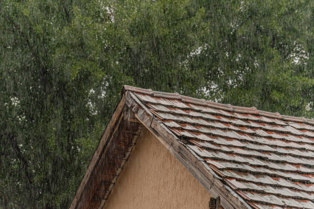 istock Summer downpour falls on a tiled roof 2160400658