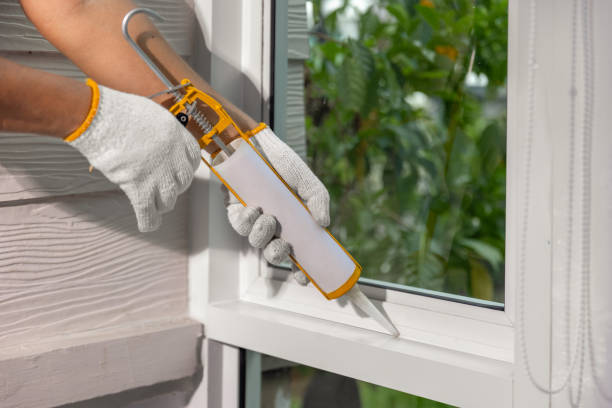 istock Construction worker using silicone sealant caulk for repair leaked inside window frame. 2160402389