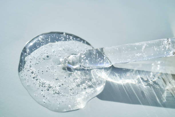 istock Pipette with serum shimmering in the sun on a blue background. 2160402465