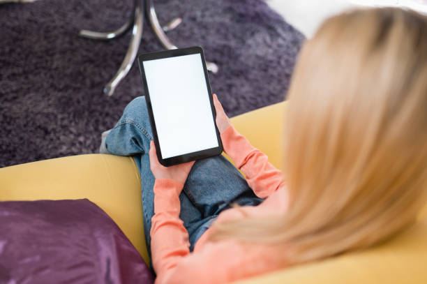 Girl holding a tablet with white mock up screen