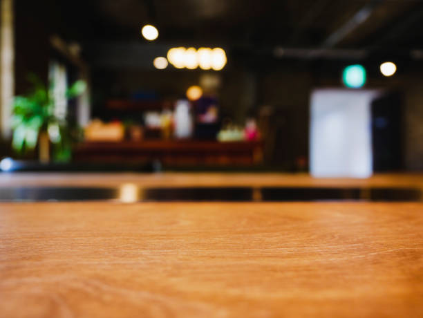 istock Table top wooden counter Bar Restaurant interior Blur background 2160410944