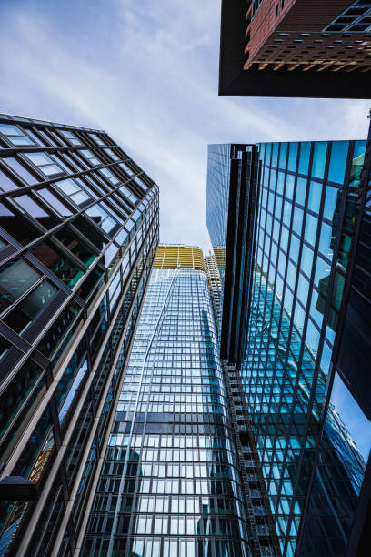 istock Low angle view of blue glass office space skyscrapers 2160413761