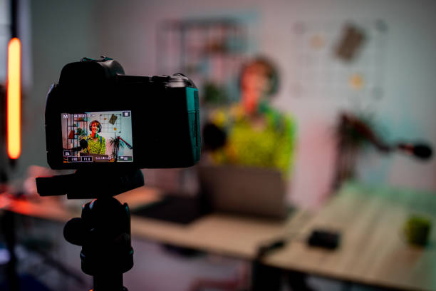 istock Camera recording a woman while podcasting 2160415746