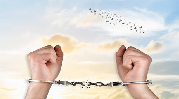 istock Freedom concept with unshackled hands 2160417126