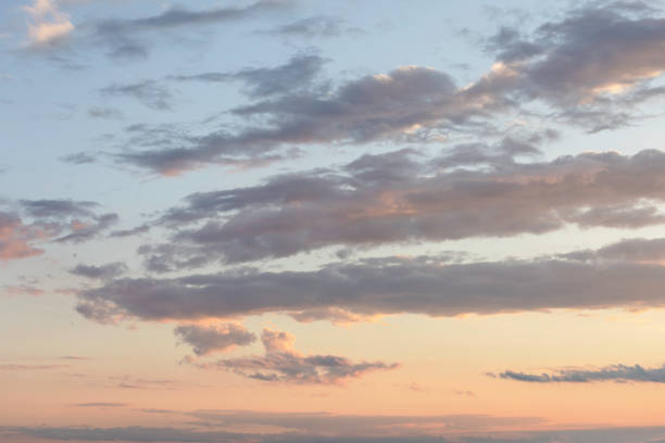 Immerse yourself in the ethereal beauty of a pastel sky adorned with shades of pink, red, and abstract cloud formations, creating a captivating backdrop for nature scenes and real estate photography. The soft sunlight gently illuminates the sky, casting a warm and inviting glow that adds a touch of serenity and charm to any setting.