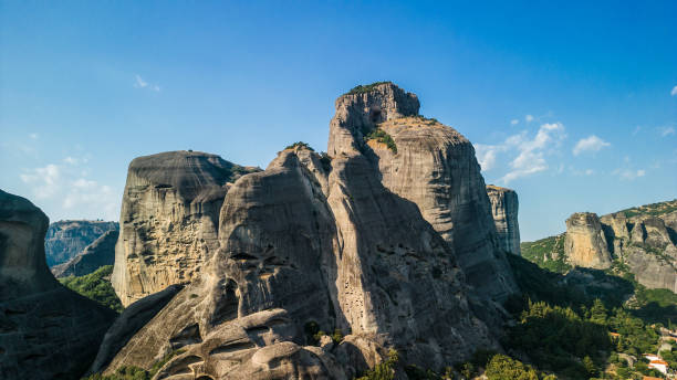 A beautiful aereal view of rock formation in Meteora, Greece during a summer sunset.