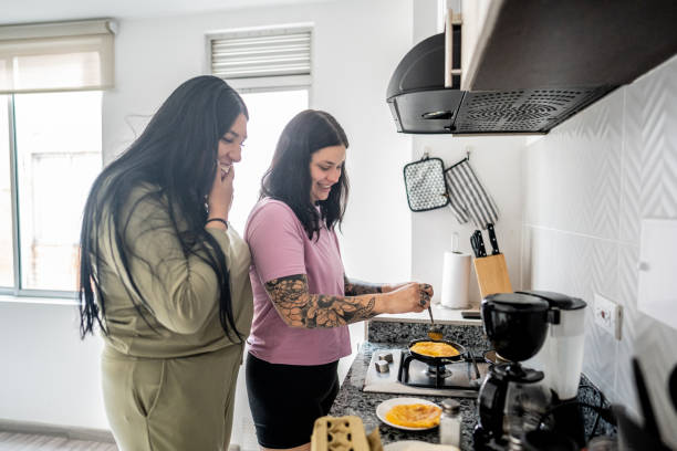 istock Lesbian couple cooking at home 2160418142