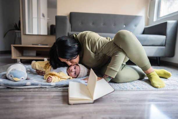 istock Mother kissing her son at home 2160420647