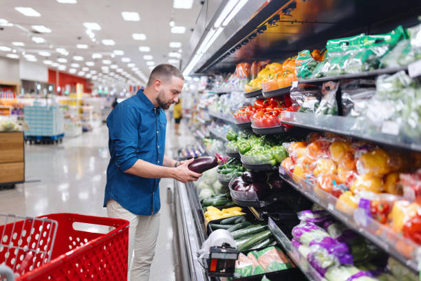 istock Man shopping for organic vegetables 2160420901