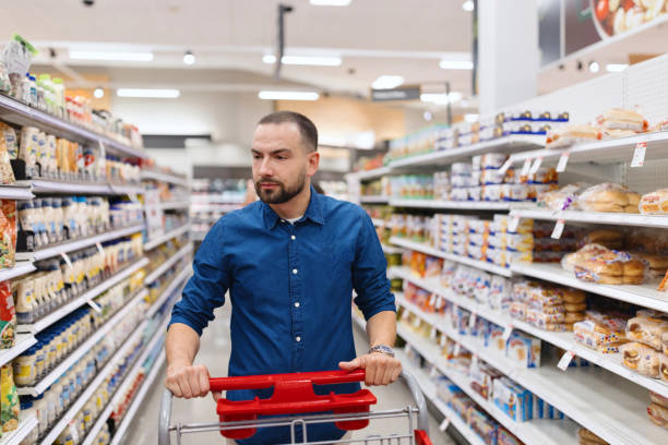 istock A male customer looks through the sweets aisle 2160420960