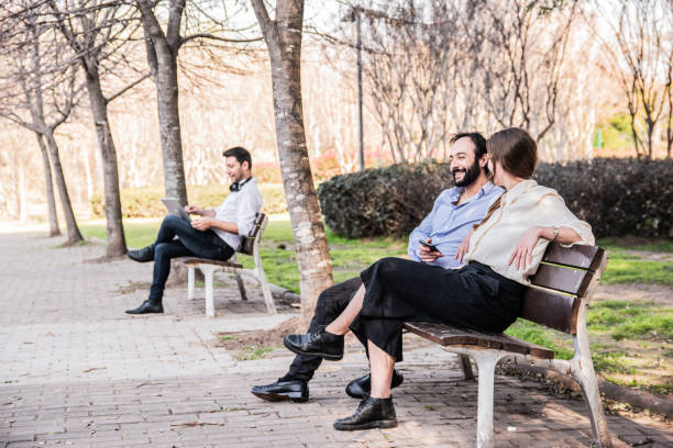 istock Coworkers talking on the public park 2160422328