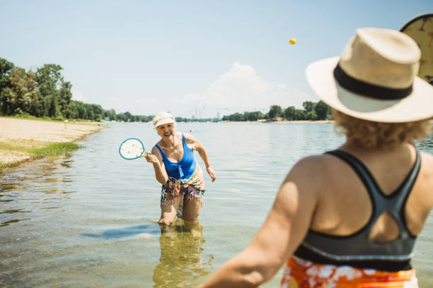 istock Happy senior woman on the beach 2160423552