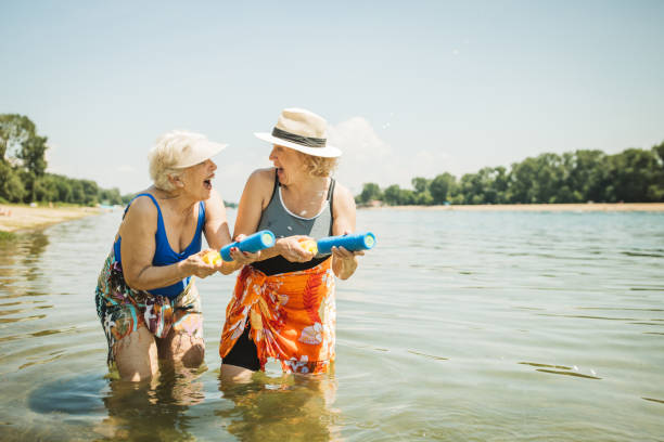 istock Happy senior woman on the beach 2160423562