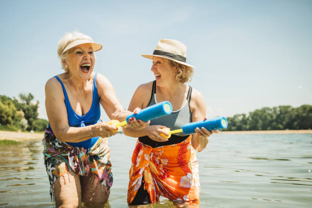 istock Happy senior woman on the beach 2160423565