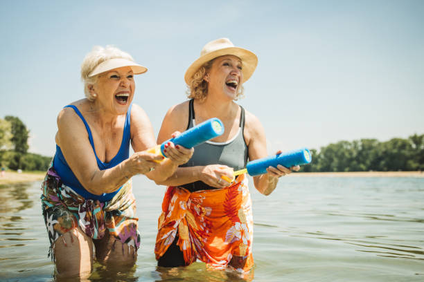 istock Happy senior woman on the beach 2160423571
