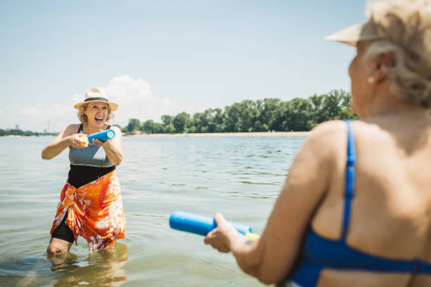 istock Happy senior woman on the beach 2160423575