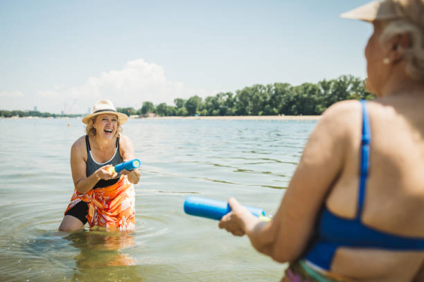 istock Happy senior woman on the beach 2160423579