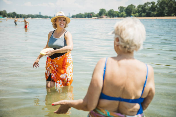 istock Happy senior woman on the beach 2160423623