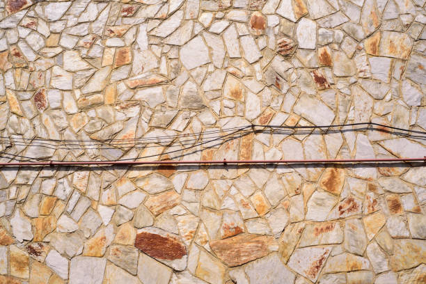 Wires in stone plates wall