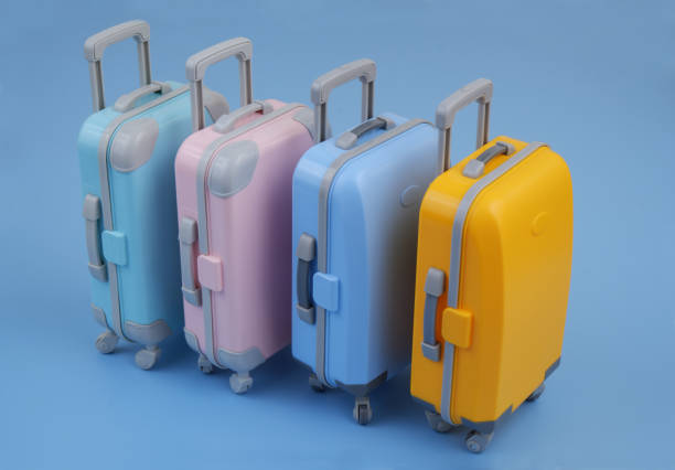 istock Many different colorful suitcases on blue background. 2160427507