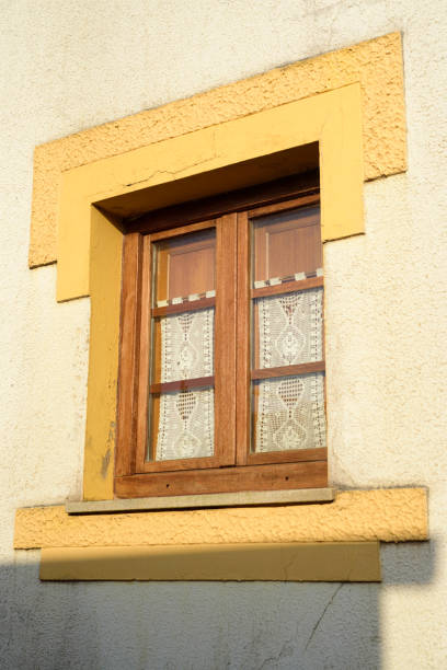 istock Crochet curtain in wood window 2160428333