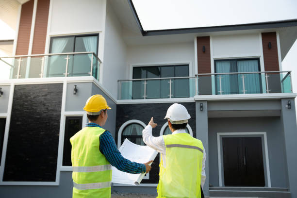 istock inspector engineer and owner project is inspecting construction and quality assurance new house. Engineers or architects or contactor work to build the house before handing it over to the homeowner 2160429947