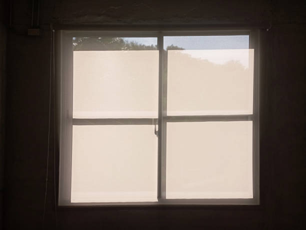 istock There is a sunlit window around the wall. A square window that creates a beautiful contrast with the surrounding walls. The room windows are shot from the inside out 2160430510