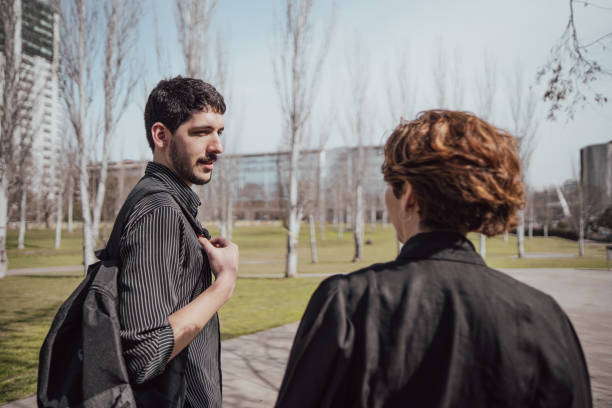 istock Businessman talking with coworker on the public park 2160430558