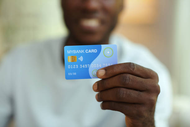 istock Man Holding His Credit Card 2160432274
