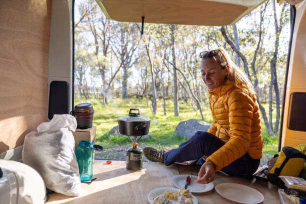 istock Woman Enjoying Breakfast in Camper Van 2160434389